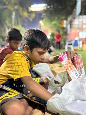 A boy opening a new kit.