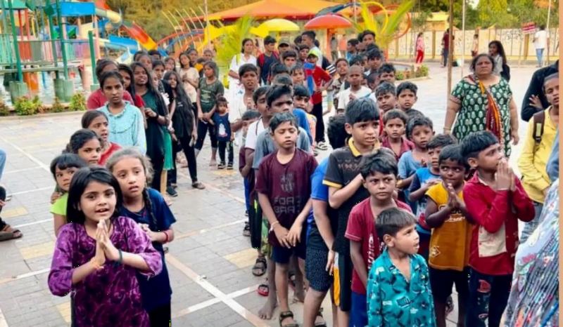 Children waiting in line at a water park.